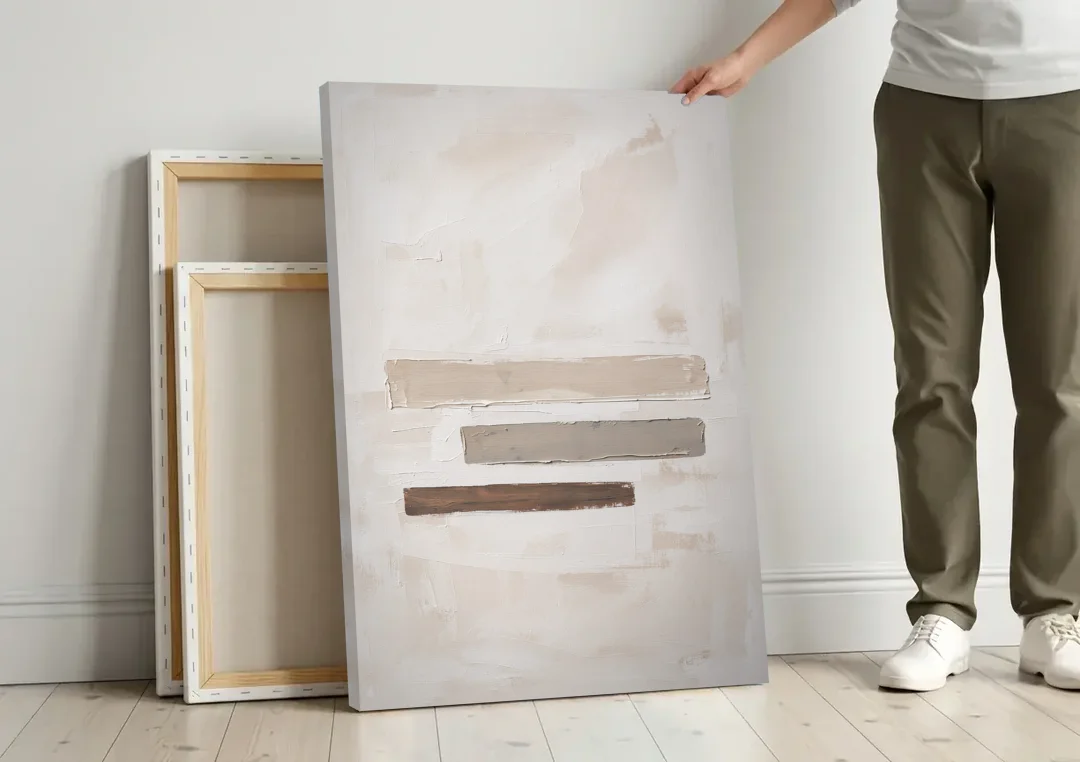 Scandinavian Abstract Art of Birch, Ash and Walnut Bars canvas wall art leaning against a wall next to blank canvases