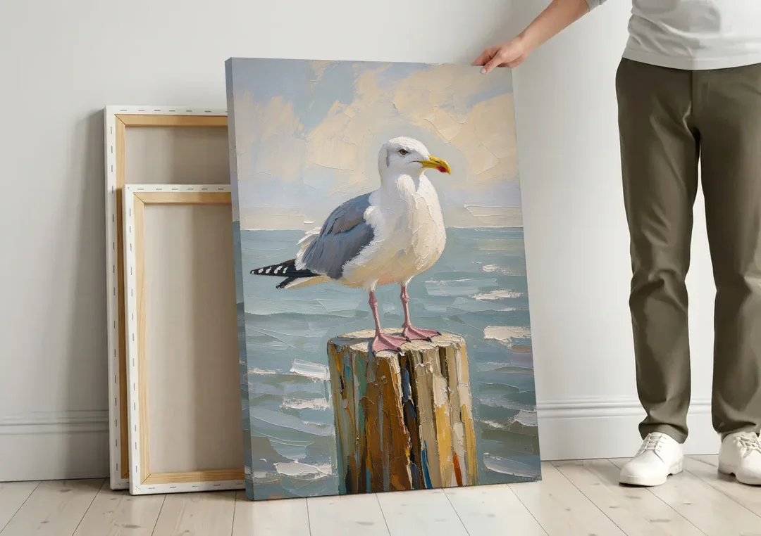 Seagull Painting on the Weathered Dock Post canvas wall art leaning against a wall next to blank canvases