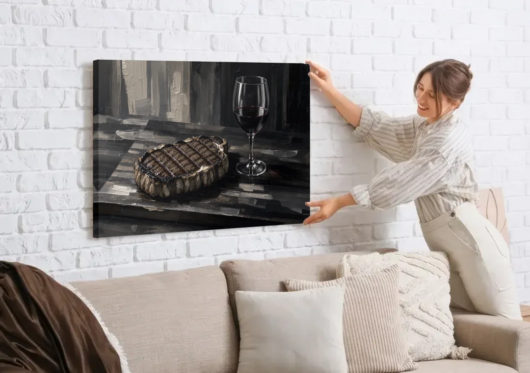 Seared Steak and Red Wine Palette Knife Painting canvas wall art being hung on a white brick wall above a sofa