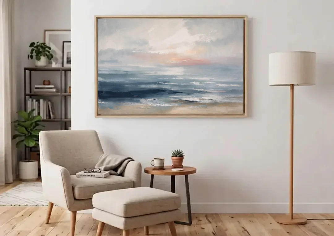 Seascape Painting of a Misty Dawn Horizon canvas wall art above an armchair in a bright living room