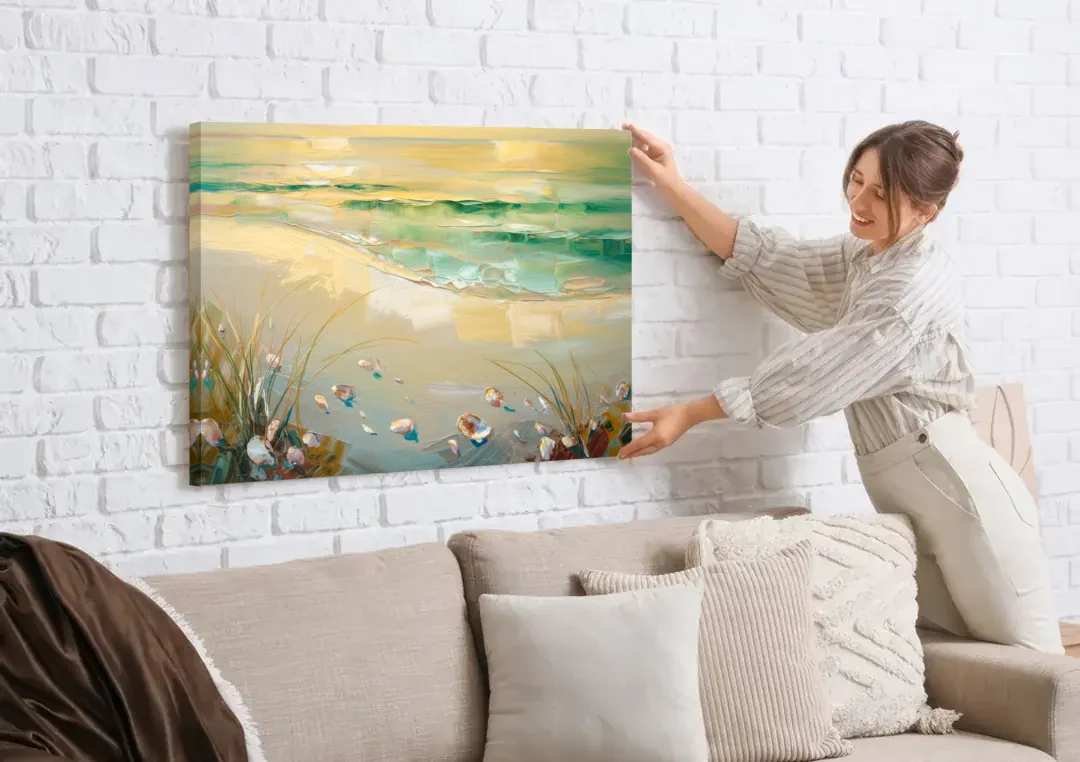 Seaside Beachfront Serenity canvas wall art being hung on a white brick wall above a sofa