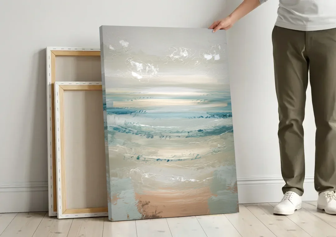 Seaside Blue Horizon canvas wall art leaning against a wall next to blank canvases