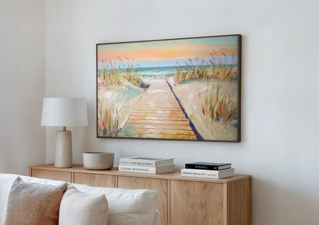 Seaside Boardwalk Dreams canvas wall art above a wooden sideboard next to a sofa