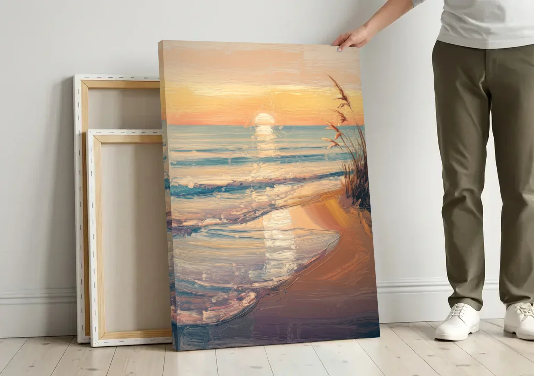 Seaside Coastal Sunrise canvas wall art leaning against a wall next to blank canvases
