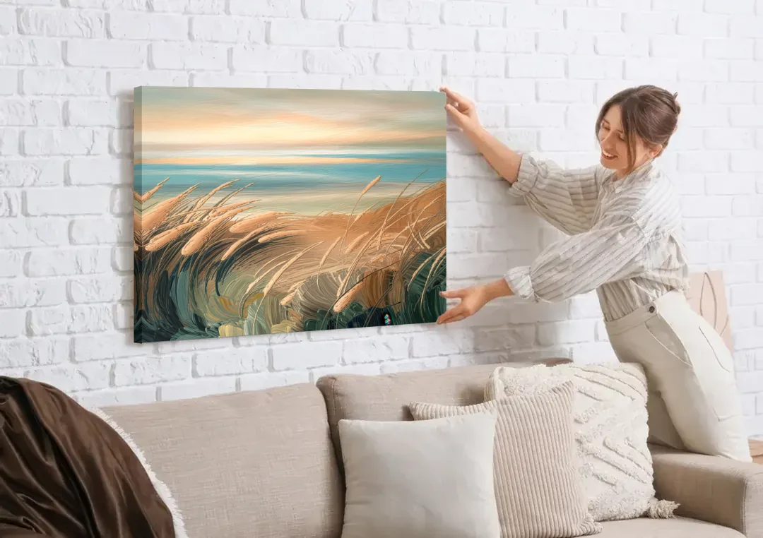 Seaside Dunes And Grass canvas wall art being hung on a white brick wall above a sofa