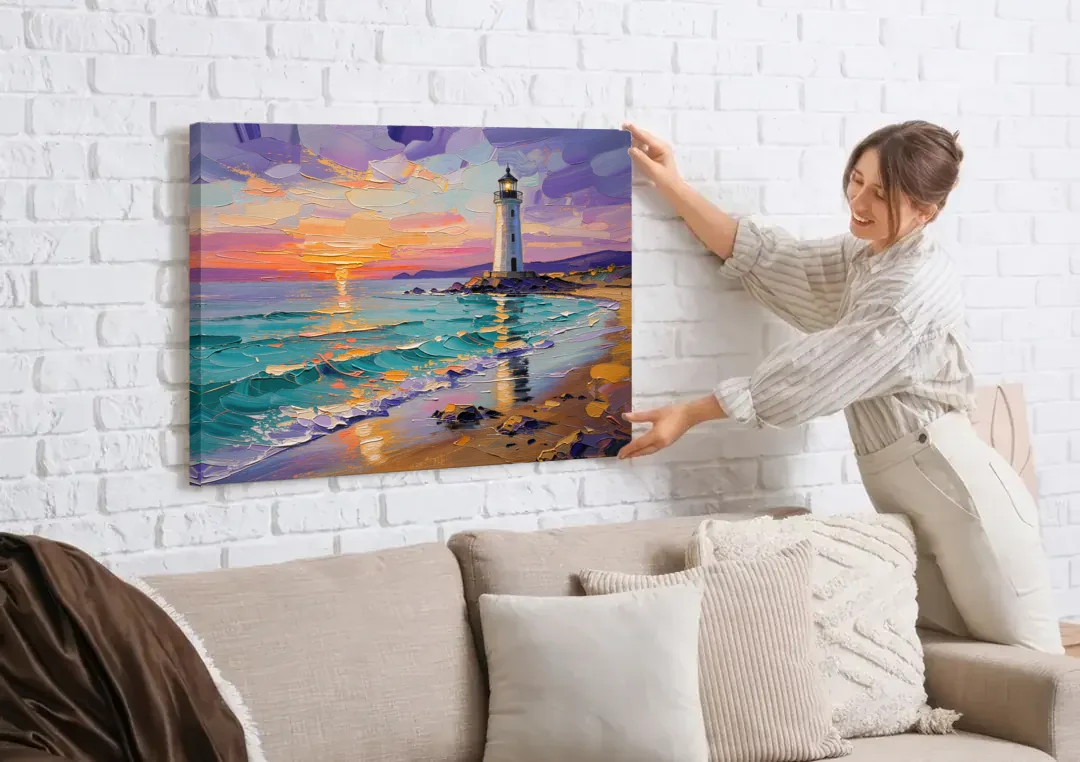 Seaside Lighthouse View canvas wall art being hung on a white brick wall above a sofa