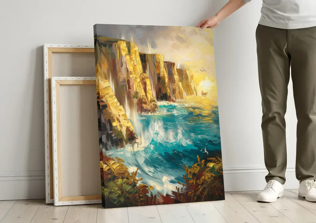 Seaside Rocky Cliffs canvas wall art leaning against a wall next to blank canvases