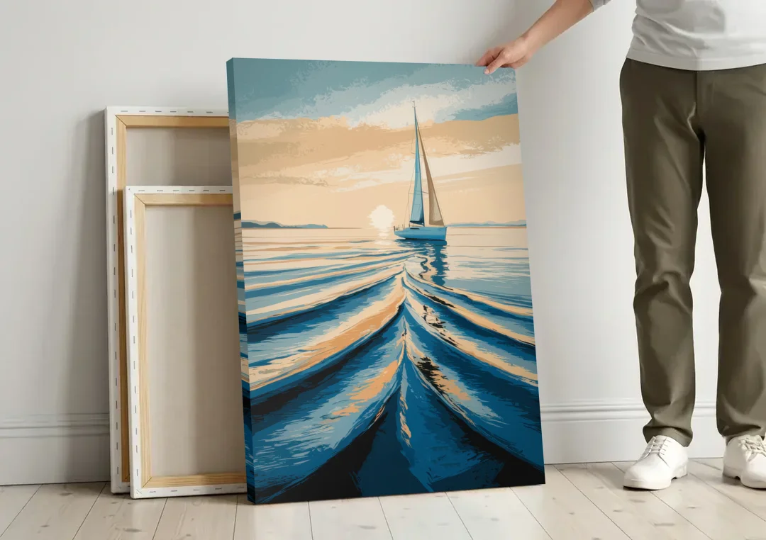 Seaside Sailboat Horizon canvas wall art leaning against a wall next to blank canvases