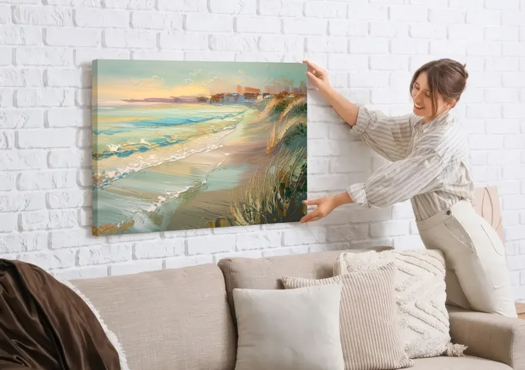 Seaside Shoreline Escape canvas wall art being hung on a white brick wall above a sofa