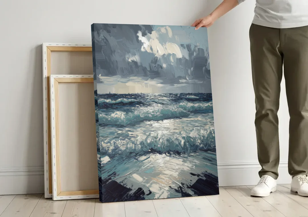 Seaside Stormy Skies canvas wall art leaning against a wall next to blank canvases