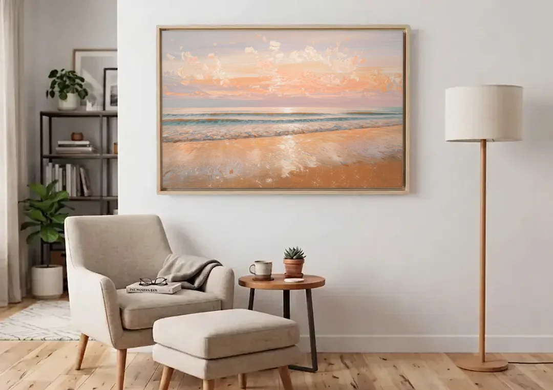Seaside Waves And Sand canvas wall art above an armchair in a bright living room