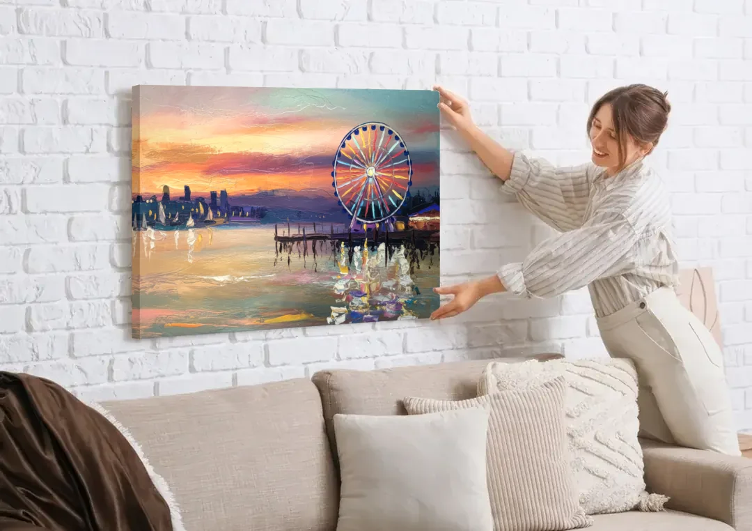 Seattle Harbor With Ferris Wheel canvas wall art being hung on a white brick wall above a sofa