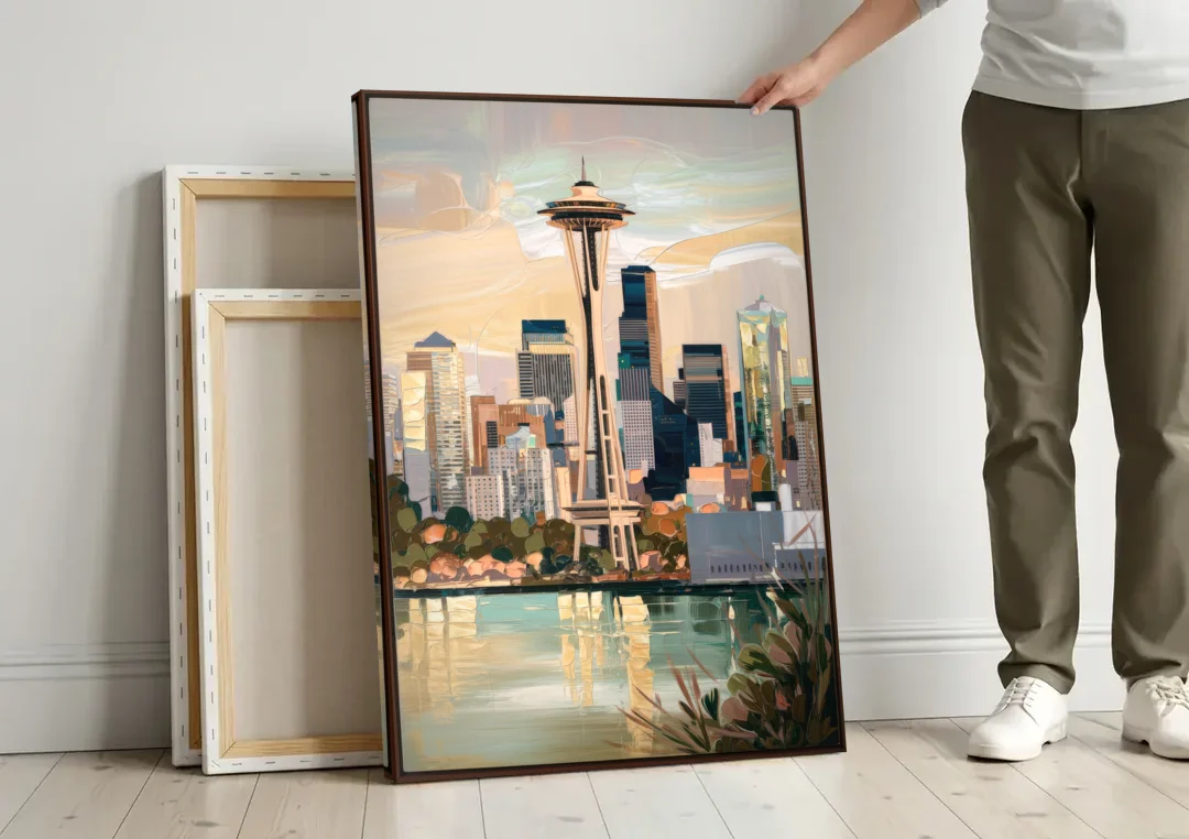 Seattle Space Needle and Cityscape canvas wall art leaning against a wall next to blank canvases