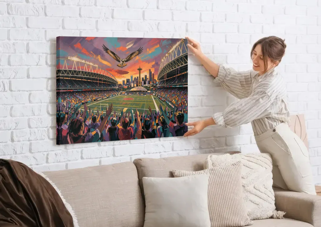 Seattle Sports Fans Unite canvas wall art being hung on a white brick wall above a sofa