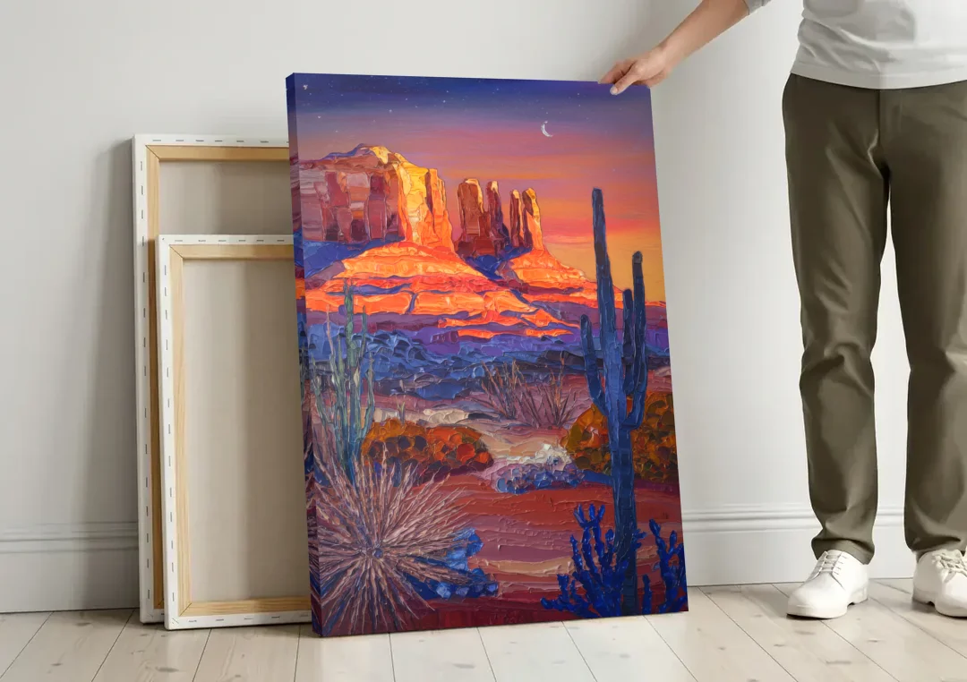 Sedona Desert Twilight canvas wall art leaning against a wall next to blank canvases