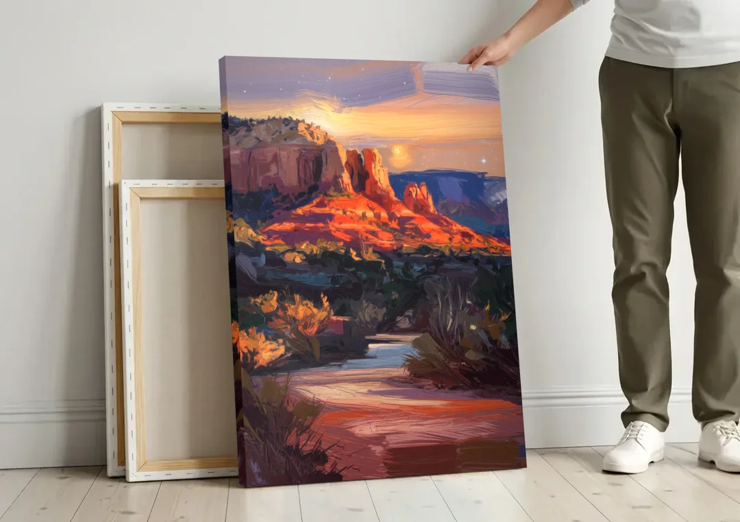 Sedona Evening Sky Glow canvas wall art leaning against a wall next to blank canvases