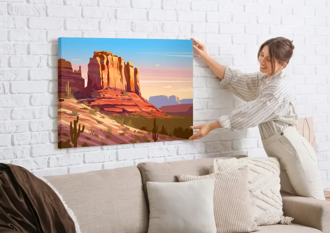 Sedona Majestic Rock Formations canvas wall art being hung on a white brick wall above a sofa