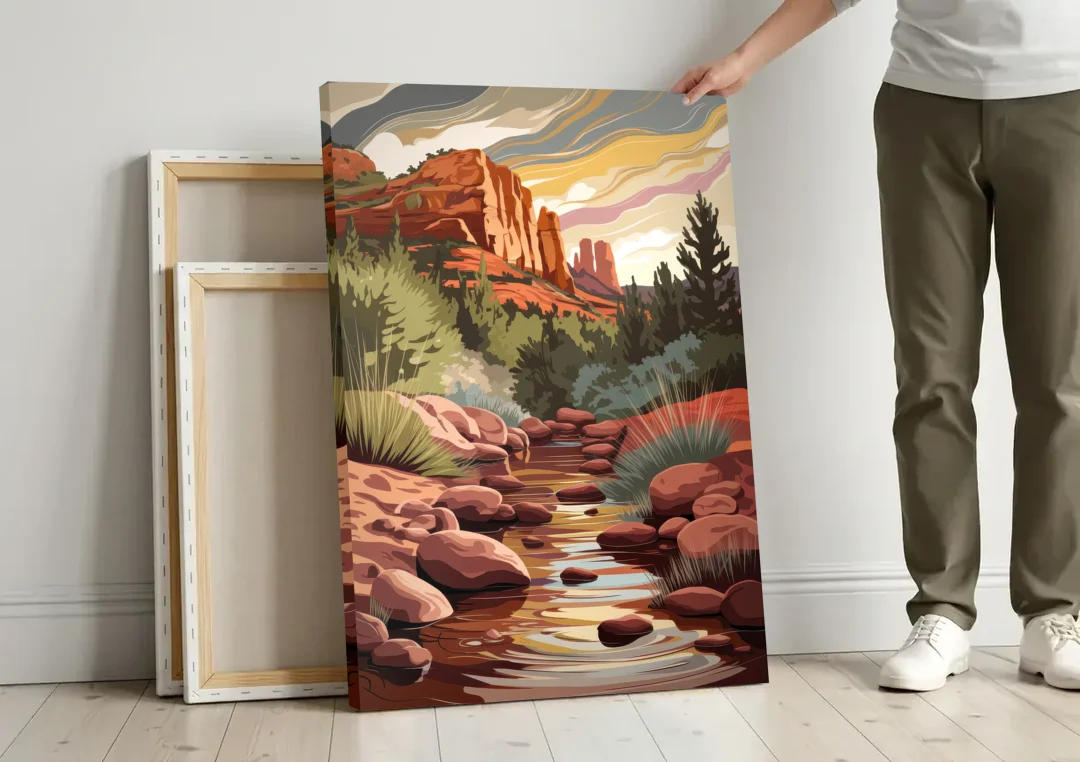 Sedona Oak Creek Reflections canvas wall art leaning against a wall next to blank canvases
