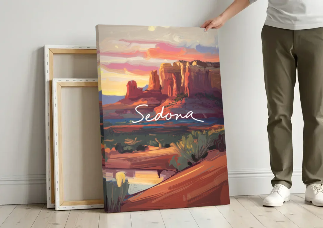 Sedona Red Rock Sunset canvas wall art leaning against a wall next to blank canvases