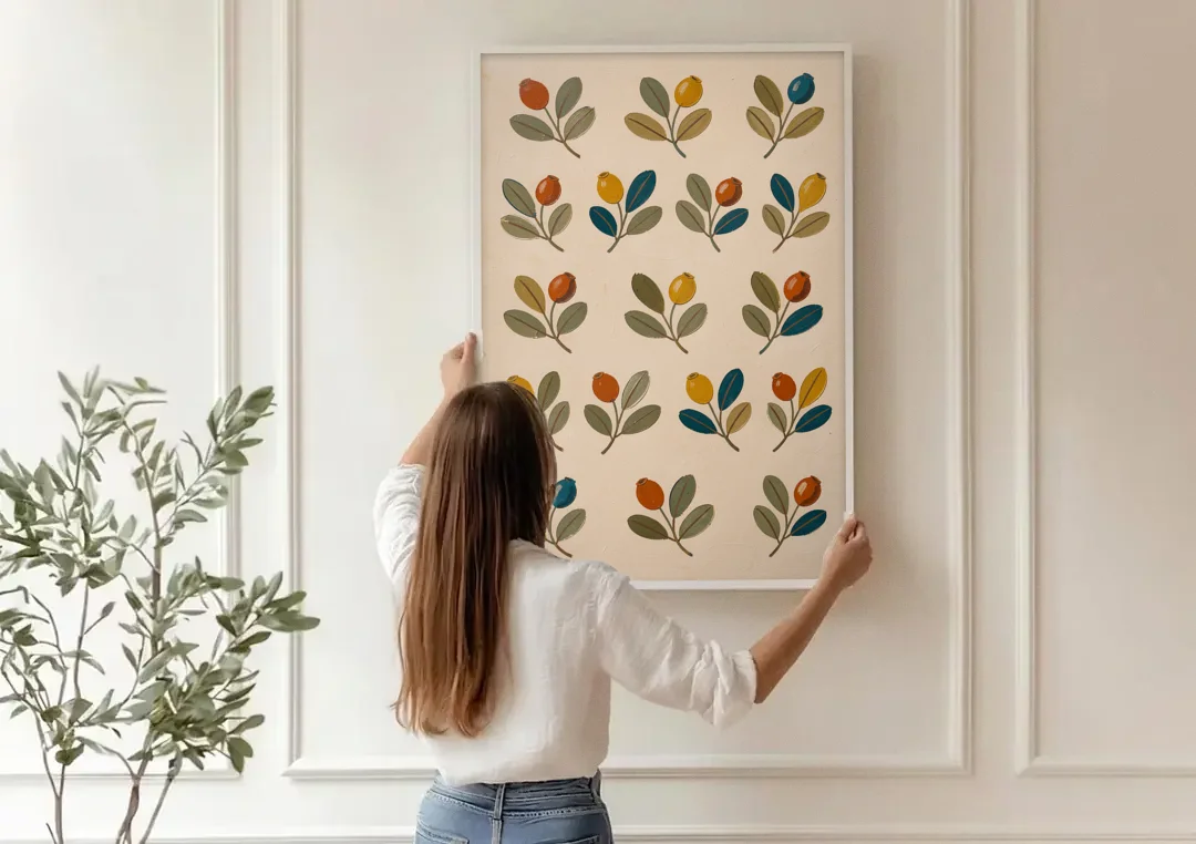 Seed Pods and Sage Leaves on Cream canvas wall art being hung on a paneled wall