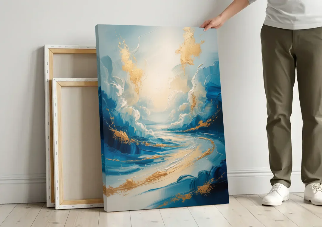 Serene Azure Elegance Blue and Gold Abstract canvas wall art leaning against a wall next to blank canvases