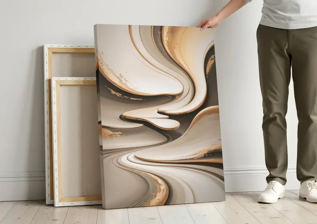 Serene Flow Beige Abstract canvas wall art leaning against a wall next to blank canvases