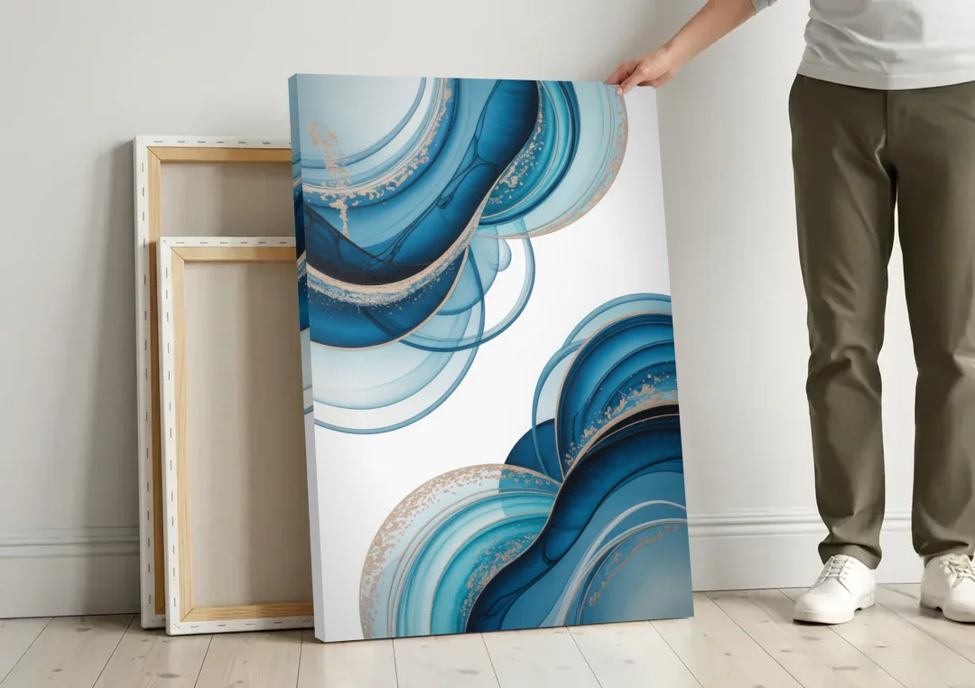 Serene Flowing Opulence Blue Abstract canvas wall art leaning against a wall next to blank canvases