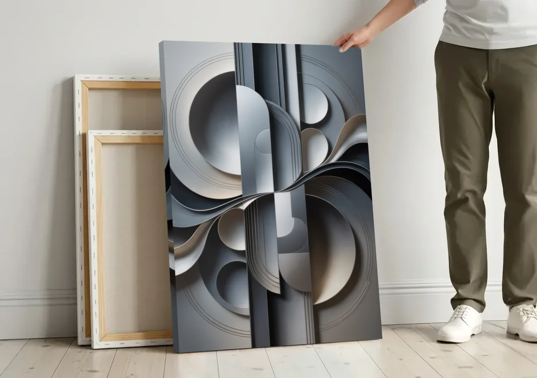 Serene Geometric Elegance Grey Abstract canvas wall art leaning against a wall next to blank canvases