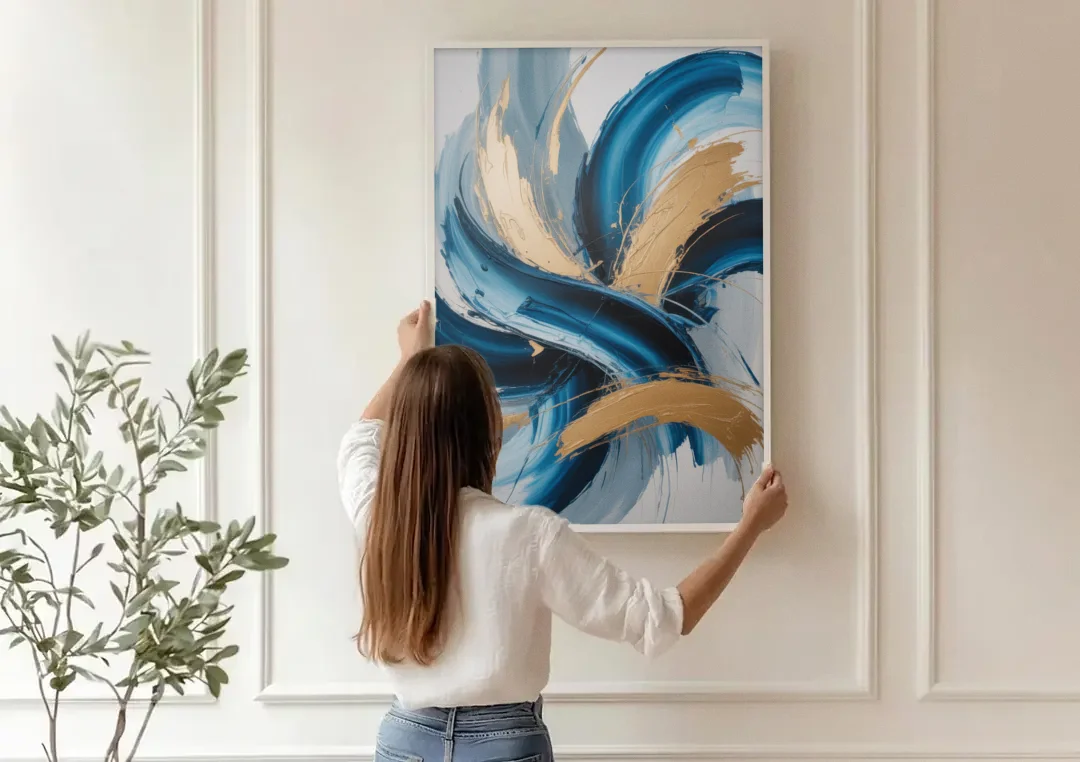 Serene Opulence Blue and Gold Abstract canvas wall art being hung on a paneled wall