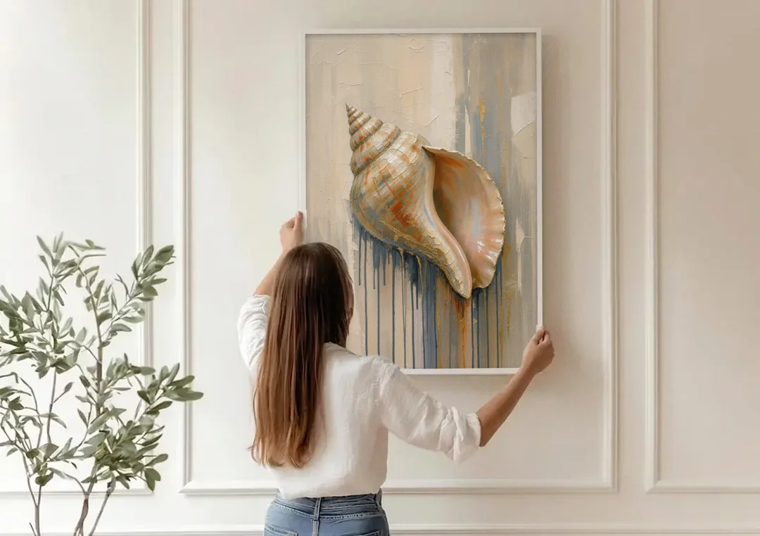 Shell Canvas Painting with Gilded Lip canvas wall art being hung on a paneled wall
