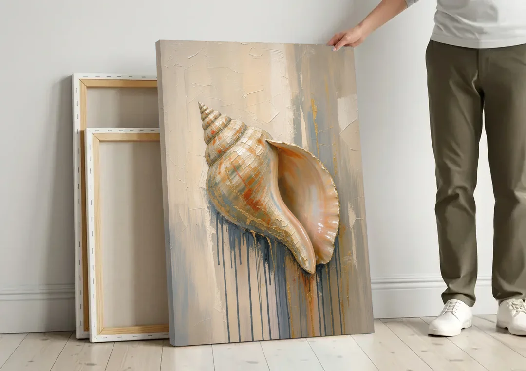 Shell Canvas Painting with Gilded Lip canvas wall art leaning against a wall next to blank canvases