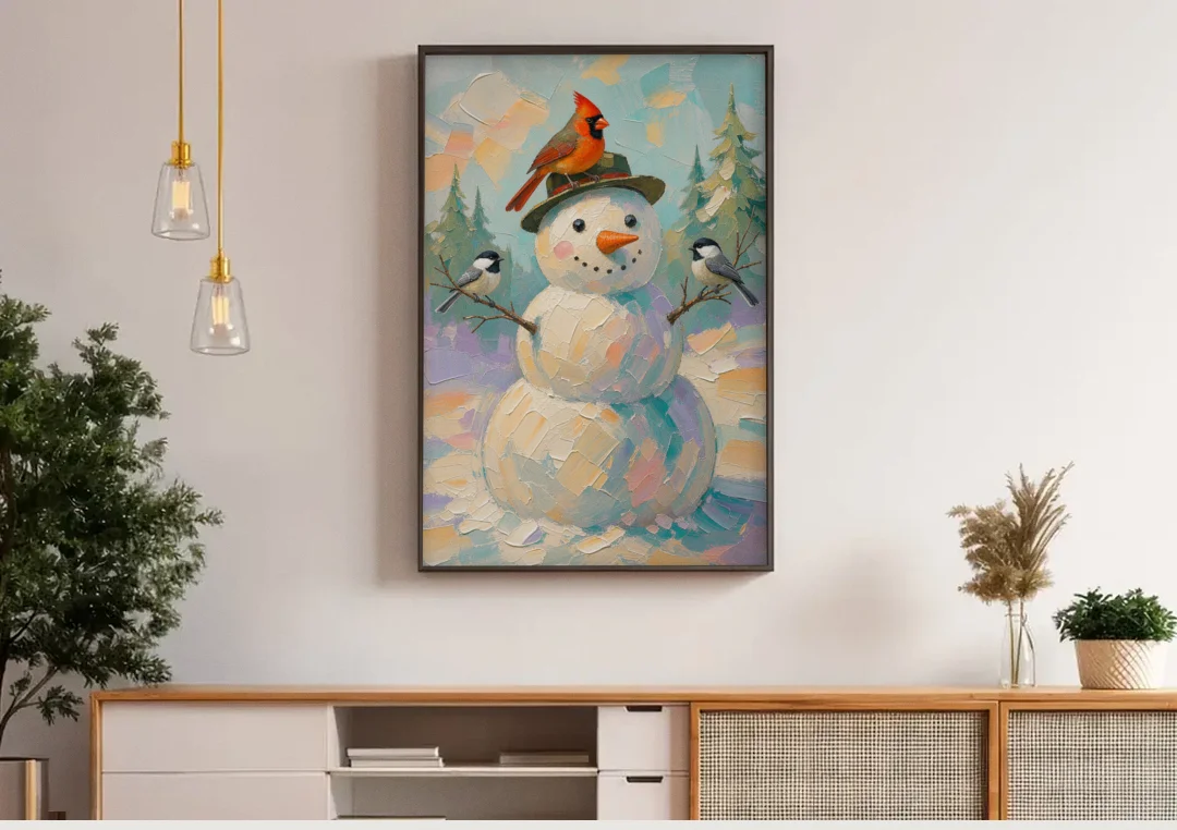 Snowman Artwork with Cardinal and Chickadees canvas wall art above a wooden sideboard under pendant lights
