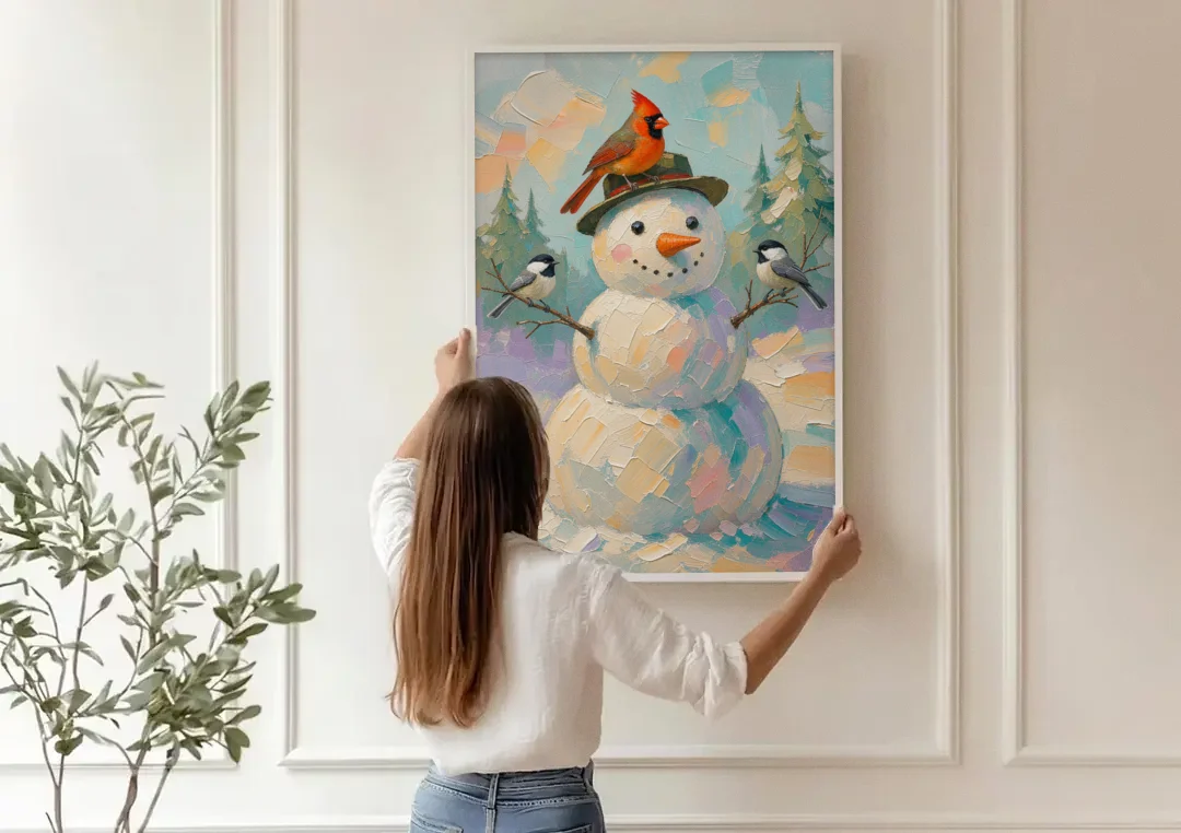 Snowman Artwork with Cardinal and Chickadees canvas wall art being hung on a paneled wall