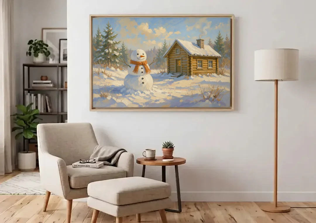 Snowman at the Log Cabin with Chimney Smoke canvas wall art above an armchair in a bright living room