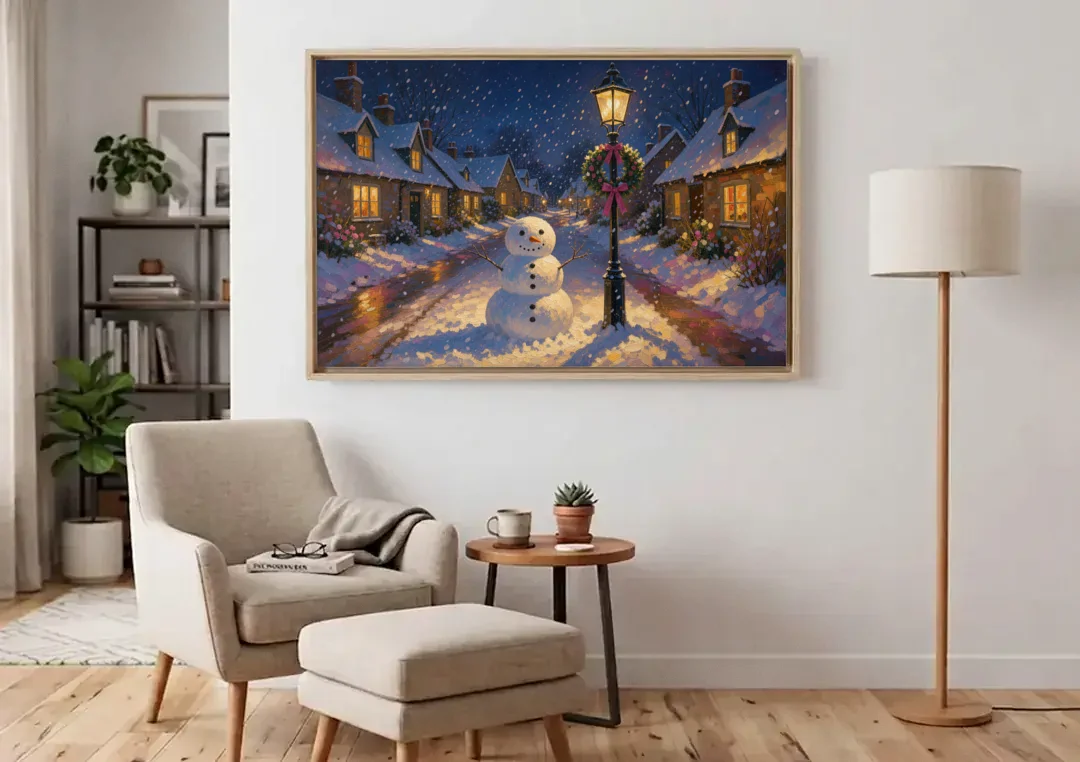 Snowman by the Wreathed Village Lamppost canvas wall art above an armchair in a bright living room