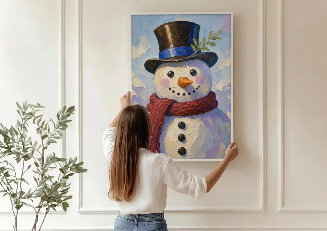 Snowman Canvas with Umber Top Hat canvas wall art being hung on a paneled wall