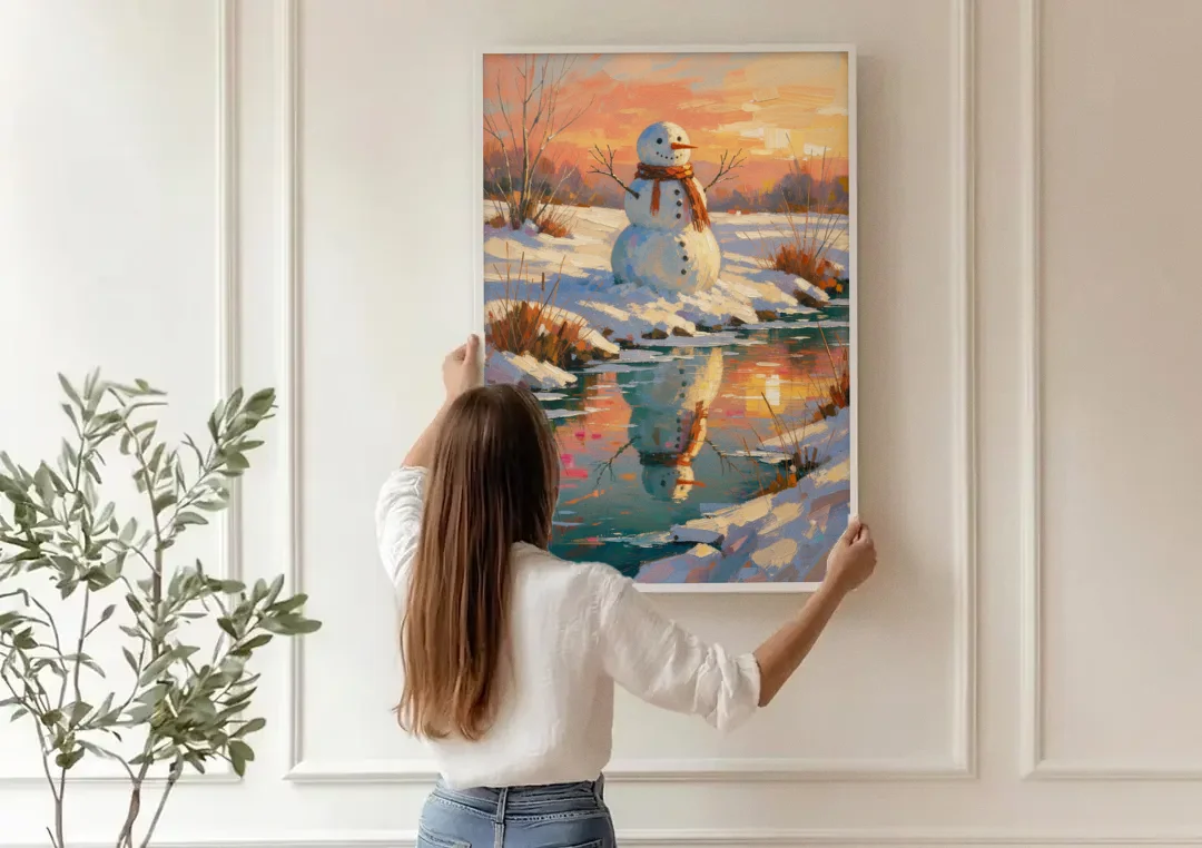 Impressionist Snowman by a Sunrise Creek canvas wall art being hung on a paneled wall