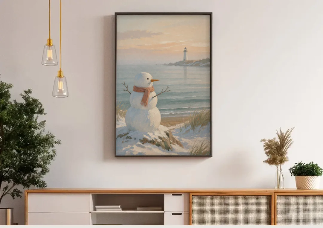 Snowman Watching the Coastal Lighthouse canvas wall art above a wooden sideboard under pendant lights