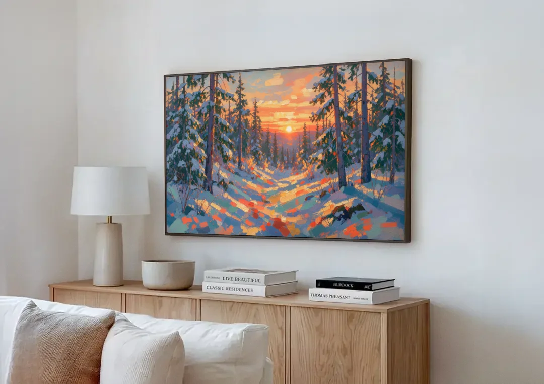 Snowy Pine Forest at Sunrise canvas wall art above a wooden sideboard next to a sofa