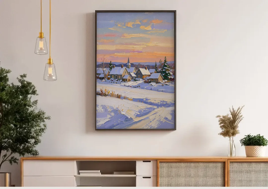 Snowy Village and Steeple at Dawn canvas wall art above a wooden sideboard under pendant lights