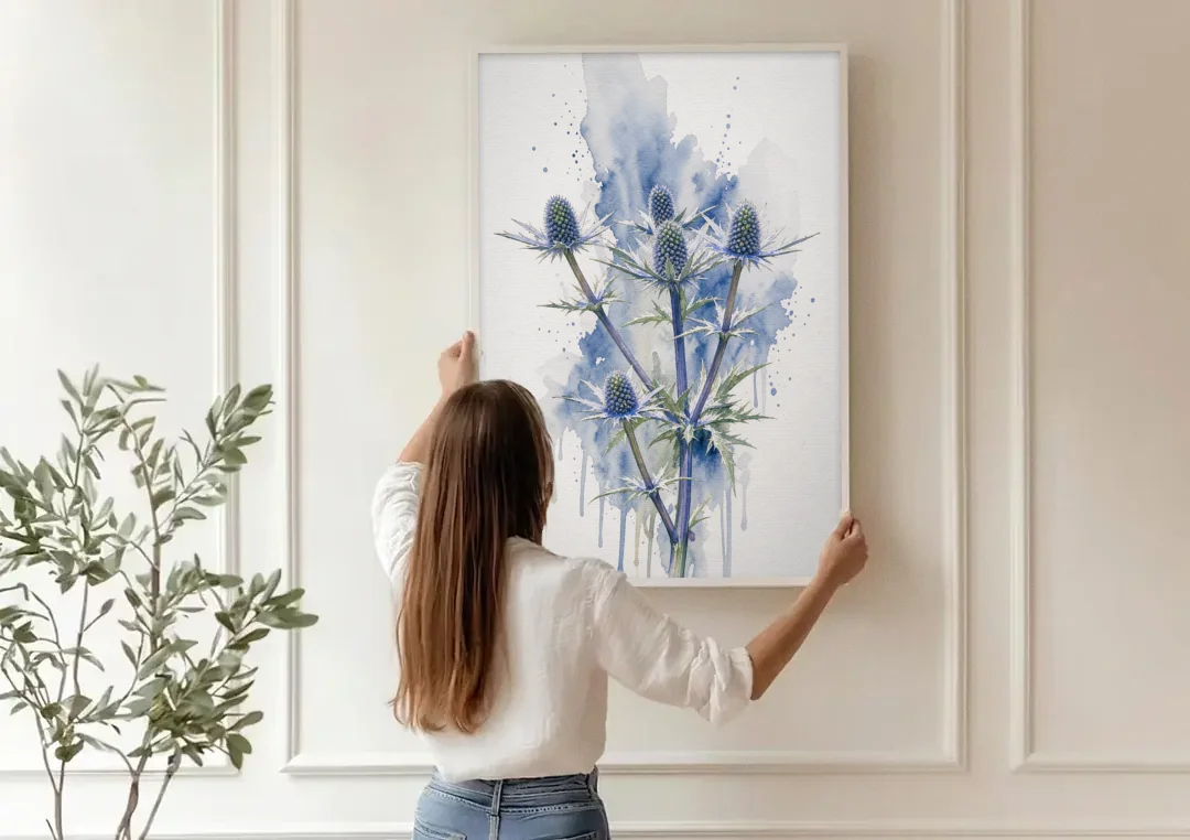 Soft Blue Wall Art of Sea Holly Thistles canvas wall art being hung on a paneled wall