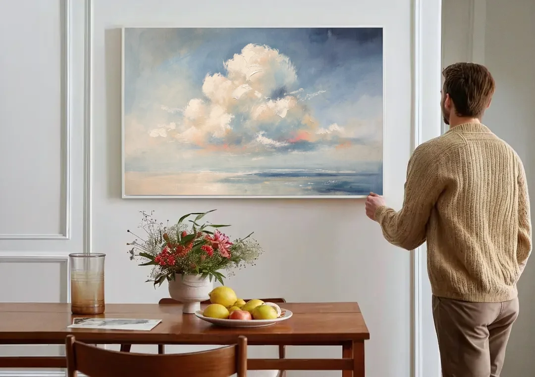 Soft Sky Painting with a Towering Cloud canvas wall art above a dining table