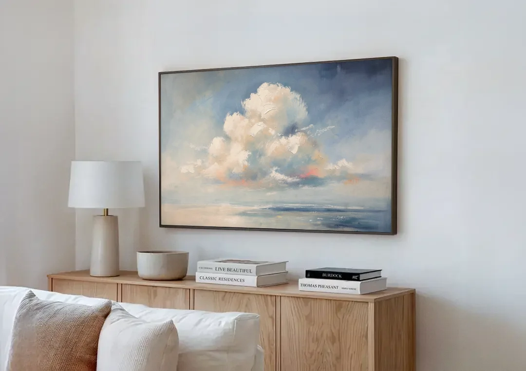 Soft Sky Painting with a Towering Cloud canvas wall art above a wooden sideboard next to a sofa