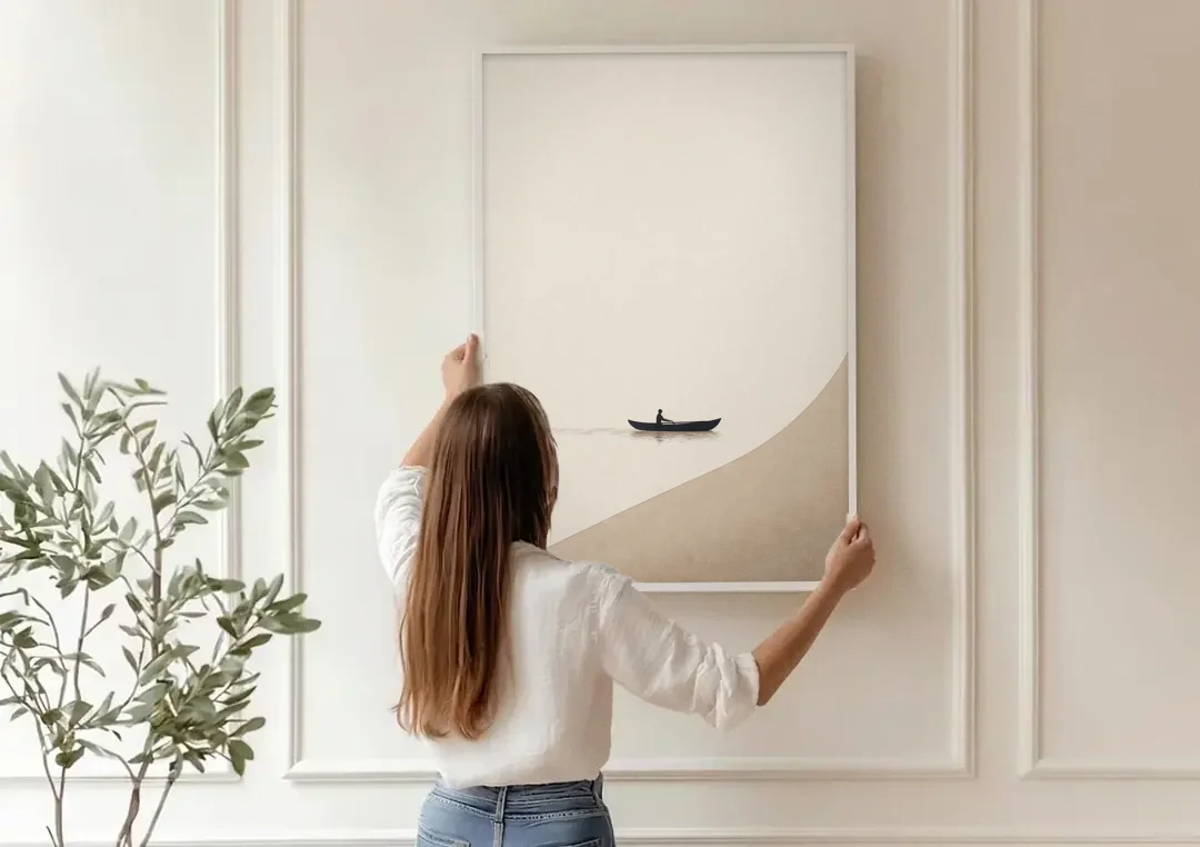Solitude Painting of a Lone Rower at Dawn canvas wall art being hung on a paneled wall