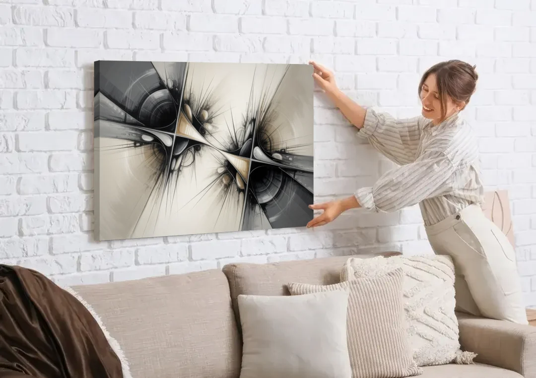 Sophisticated Interwoven Forms Black and White Abstract canvas wall art being hung on a white brick wall above a sofa