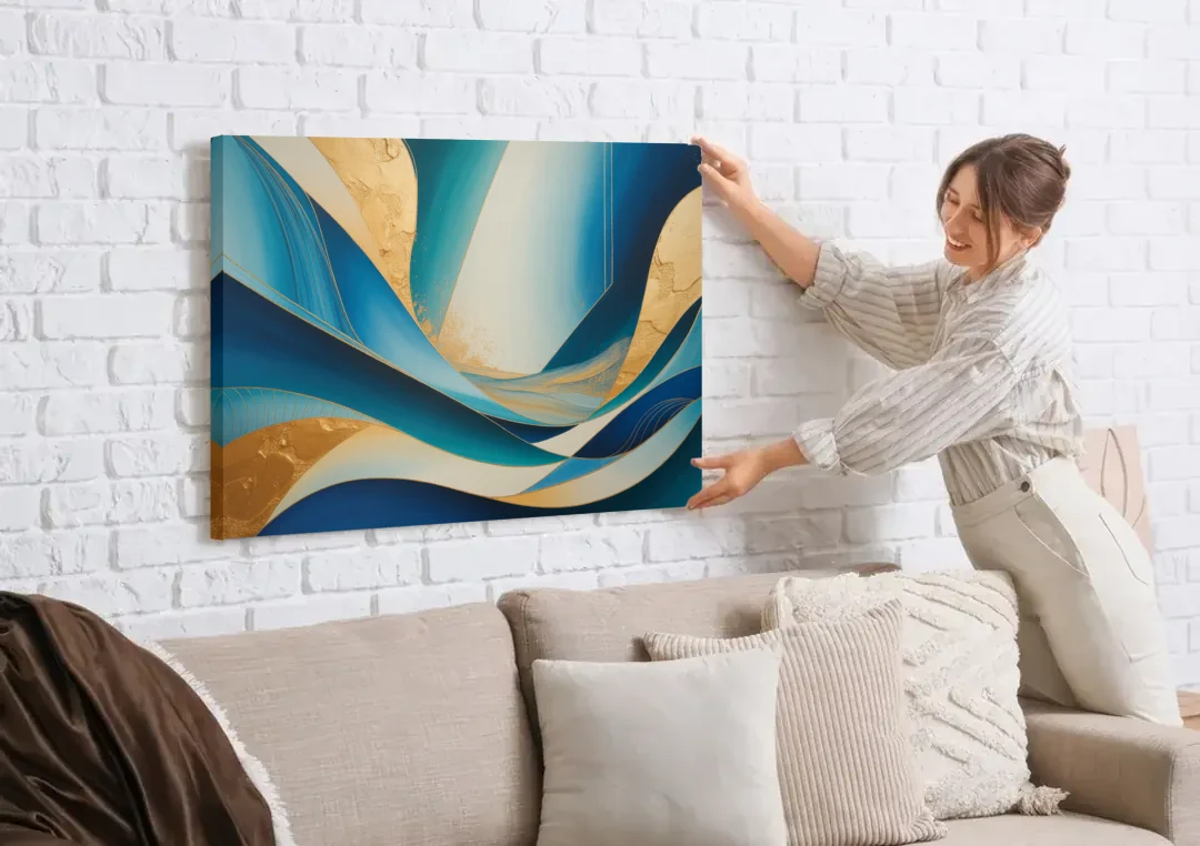 Sophisticated Tranquility Blue and Gold Abstract canvas wall art being hung on a white brick wall above a sofa