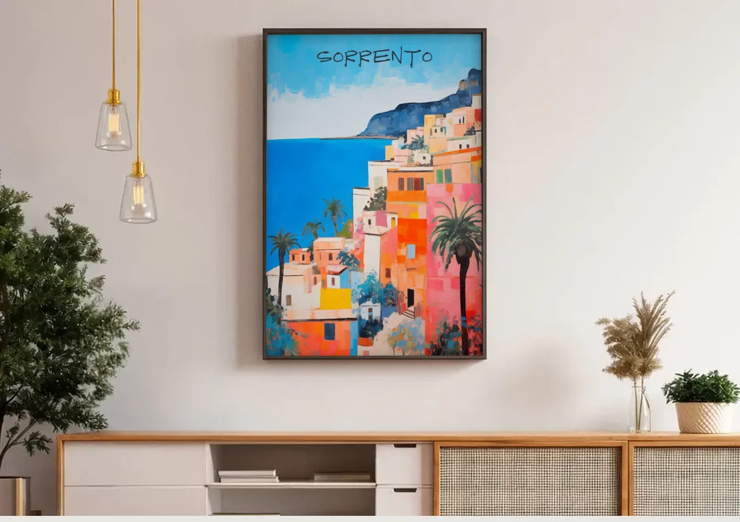 Sorrento Painting of Seaside Houses canvas wall art above a wooden sideboard under pendant lights