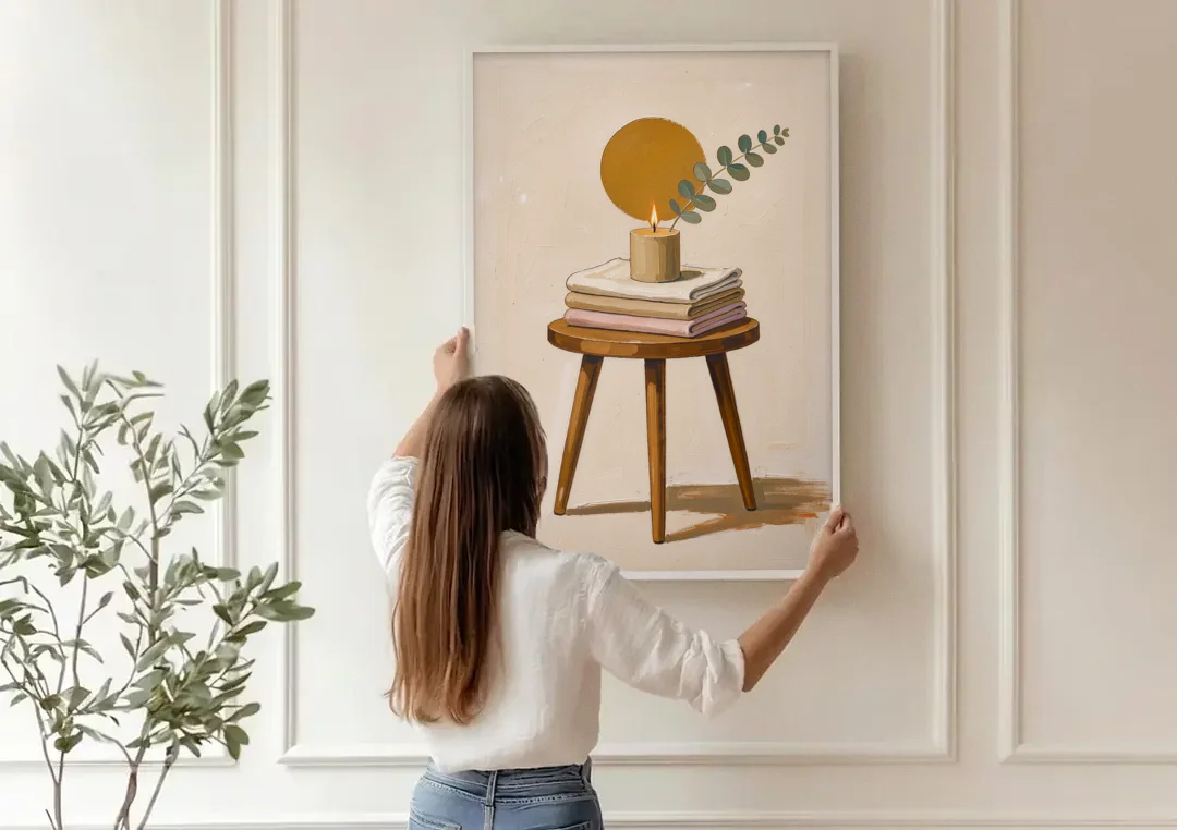 Spare Bedroom Decor with Candle and Eucalyptus canvas wall art being hung on a paneled wall