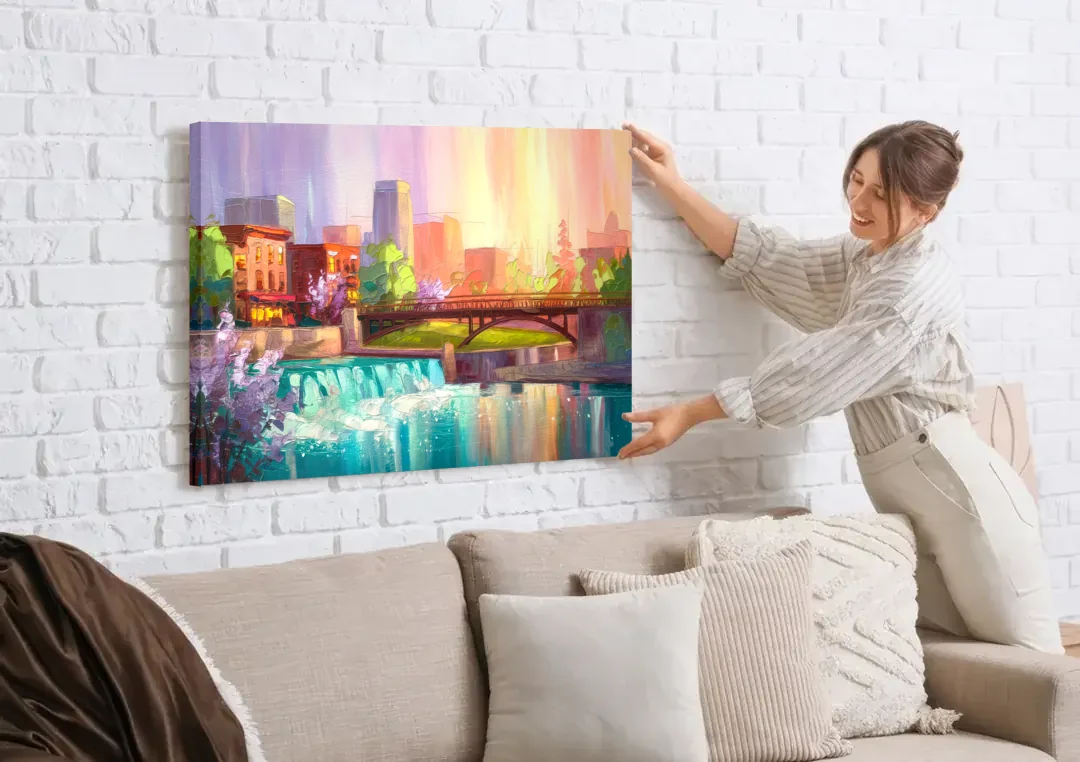Spokane Downtown Charm canvas wall art being hung on a white brick wall above a sofa