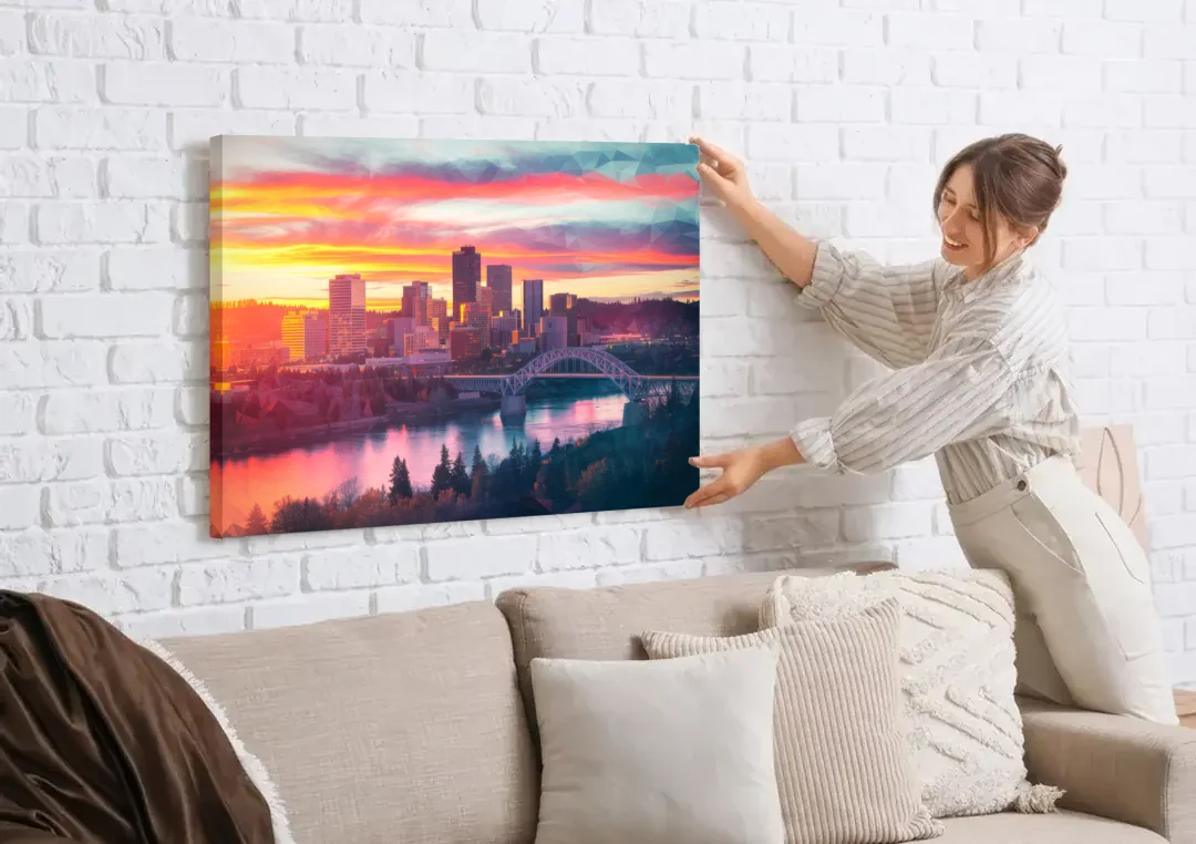 Spokane Skyline Sunset canvas wall art being hung on a white brick wall above a sofa